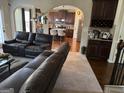 An open-concept living room that flows into a modern kitchen, perfect for entertaining guests at 860 Nevis Way, Mcdonough, GA 30253