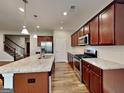Beautiful kitchen featuring stainless steel appliances, wooden cabinets, and a large granite island at 471 Lanier Ct, Hiram, GA 30141