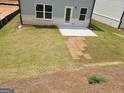 Spacious backyard featuring a freshly poured concrete patio and partially installed sod at 13 Butternut Way # 120B, Auburn, GA 30011