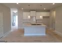 Bright, modern kitchen with granite countertops, white cabinets, pendant lighting, and tile backsplash at 42 Avian Way # 128B, Auburn, GA 30011