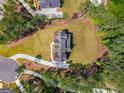 Aerial view of the beautiful home and its large lot with a circular driveway at 100 Regina Ct, Fayetteville, GA 30215