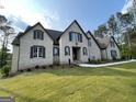 Beautiful two-story home featuring well-manicured lawn and inviting entrance at 100 Regina Ct, Fayetteville, GA 30215