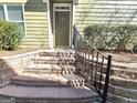 Inviting front entrance with stone steps and wrought iron railing at 2540 leads to front door at 2540 Willow Grove Road Nw Rd # 15, Acworth, GA 30101