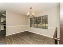 Well-lit dining room with modern chandelier and large window at 2624 Windridge Dr, Acworth, GA 30102