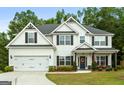Charming two-story home with a well-manicured lawn, two car garage and tasteful landscaping at 8 Saint Charles Ave, Sharpsburg, GA 30277