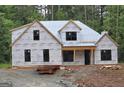 New construction home featuring modern windows and a covered front entry at 2039 Fischer Rd, Sharpsburg, GA 30277