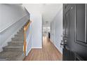 Inviting foyer with hardwood floors and a staircase leading to the upper level at 695 Georgetown Ct, Jonesboro, GA 30236