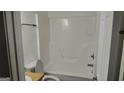 Clean and functional full bathroom with white fixtures, including a shower/tub combo and toilet at 1581 Jersey Social Circle Rd, Covington, GA 30014