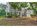 Traditional two-story home featuring an attached two-car garage and mature landscaping at 1132 Hargrove Ct, Locust Grove, GA 30248