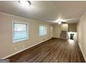 Bright living room featuring hardwood floors and neutral paint at 3158 Wisteria Way, East Point, GA 30344