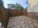 Cozy patio space with decorative stone flooring and wood fencing offers a private outdoor retreat at 292 Twiggs Cor, Peachtree City, GA 30269