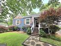 Charming home showcasing a manicured front yard, lovely landscaping, and a welcoming entrance at 3226 Hope St, Hapeville, GA 30354