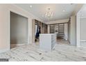 Spacious closet features shelving, cabinets, and stylish chandelier at 4030 River Ridge Chase Se, Marietta, GA 30067