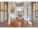 Grand foyer with dark wood floors, high ceilings, and an open view of the home at 265 Beverly Farms Dr, Sharpsburg, GA 30277