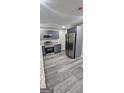 Spacious kitchen showcasing stainless steel appliances, gray cabinets, and durable flooring at 4059 Canby Ln, Decatur, GA 30035