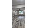 Bright living room featuring modern flooring and a ceiling fan at 4059 Canby Ln, Decatur, GA 30035