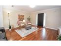 Cozy living room with hardwood floors, ample natural light, and stylish decor at 482 N Jeff Davis Dr, Fayetteville, GA 30214