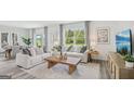 Bright and airy living room with stylish furnishings, large windows, and modern decor accents at 5451 Baybrook Cir, South Fulton, GA 30349