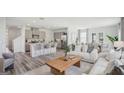 Open-concept living space seamlessly connects the living room, kitchen, and dining area for easy entertaining at 5451 Baybrook Cir, South Fulton, GA 30349