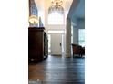 Grand foyer with soaring ceilings and an arched window at 8035 Magnolia Way, Roswell, GA 30075