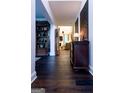 Elegant hallway features hardwood floors and beautiful decor at 8035 Magnolia Way, Roswell, GA 30075