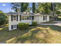 Inviting two-story home with a well-maintained yard and a classic white picket fence at 1854 Shadydale Se Ave, Atlanta, GA 30315