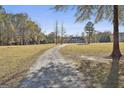 Spacious property with a long driveway leading to a beautiful brick home at 395 W Mcintosh Rd, Brooks, GA 30205