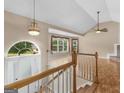 Bright, open foyer with hardwood floors, a vaulted ceiling, and abundant natural light at 230 Cobblestone Ln, Mcdonough, GA 30252
