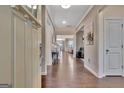 Inviting foyer with wood floors and neutral walls, leading into the home's main living spaces at 411 Southbridge Pass, Peachtree City, GA 30269
