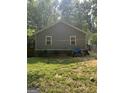 The backyard has lawn and a view of the back of the home at 1063 Nw Cato Nw St, Atlanta, GA 30318