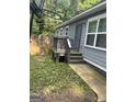 Side view of a home showing a back entrance with a small porch and steps at 1063 Nw Cato Nw St, Atlanta, GA 30318