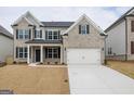 Attractive two-story home with a brick and siding exterior and an attached two-car garage with a long driveway at 3468 Jasmine Sw Way, South Fulton, GA 30331