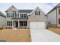 Attractive two-story home with a brick facade, black shutters, and an attached two-car garage on a large lot at 3468 Jasmine Way Sw, South Fulton, GA 30331