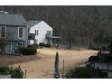 Picturesque backyard offering serene views and mature trees, ideal for relaxation at 1602 Riverbend Club Drive, Atlanta, GA 30339