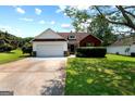 Charming single-Gathering home with a well-maintained lawn, attached two-car garage, and classic curb appeal at 8180 Chapman Ter, Mcdonough, GA 30252