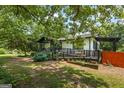 Charming single-Gathering home featuring mature landscaping and a welcoming front porch at 98 Maddox Dr, Mcdonough, GA 30252
