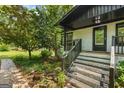 Inviting front porch with steps, providing a charming entrance to the home at 98 Maddox Dr, Mcdonough, GA 30252