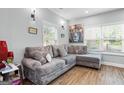 Comfortable living room featuring a large sectional sofa, natural light, and modern decor at 1174 Princess Sw Ave, Atlanta, GA 30310