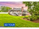 Expansive backyard featuring a multi-level deck, mature trees, and landscaped yard at 150 Old Plantation Way, Fayetteville, GA 30214