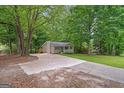 View of the home from the driveway, featuring a well-maintained front yard and cozy exterior at 438 Punkintown Rd, Villa Rica, GA 30180