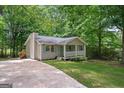 Home exterior with siding, a quaint front porch, and a well-manicured lawn at 438 Punkintown Rd, Villa Rica, GA 30180