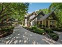 This home features an attractive exterior, long driveway, and lush, well-maintained front yard landscaping at 508 Hastings Dr, Peachtree City, GA 30269