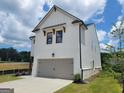 Charming two-story home with a two-car garage and well-manicured lawn at 43 Avian Way # 3B, Auburn, GA 30011
