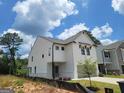 Exterior view of a modern two-story home with white siding and stylish architectural details at 43 Avian Way # 3B, Auburn, GA 30011