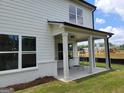 Covered patio featuring classic white columns with a view of the home's exterior at 43 Avian Way # 3B, Auburn, GA 30011