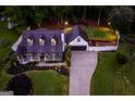 Aerial view of a home with a backyard football field, a play set, and a long driveway at 870 Rutherford Dr, Dacula, GA 30019