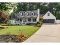 Two-story home with attached garage, well-maintained lawn, and inviting curb appeal at 870 Rutherford Dr, Dacula, GA 30019