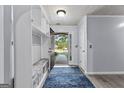 Inviting entryway with built-in storage and a view of the outdoors at 11765 Fairway Overlook, Fayetteville, GA 30215