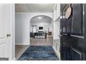 Open-concept living room with fireplace and modern decor at 11765 Fairway Overlook, Fayetteville, GA 30215