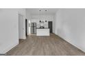 View of bright open living space with luxury vinyl plank floors and updated kitchen at 1226 Byewood Sw Ln, Atlanta, GA 30310